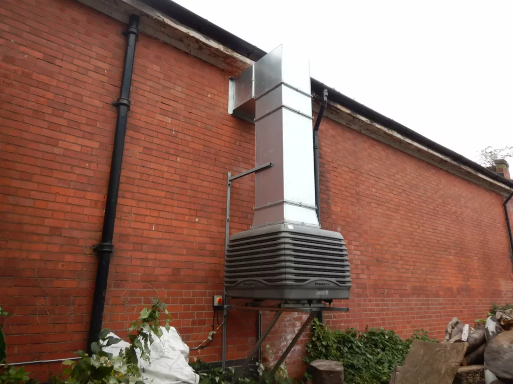 Industrial Evaporative cooling breeze air unit on side of building