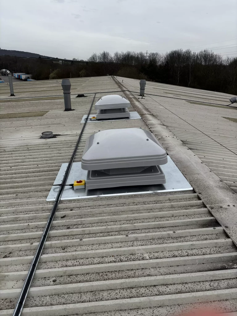 Ventilation units on roof of industrial building.